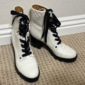 Madden girl white and black heeled lace up boots.
